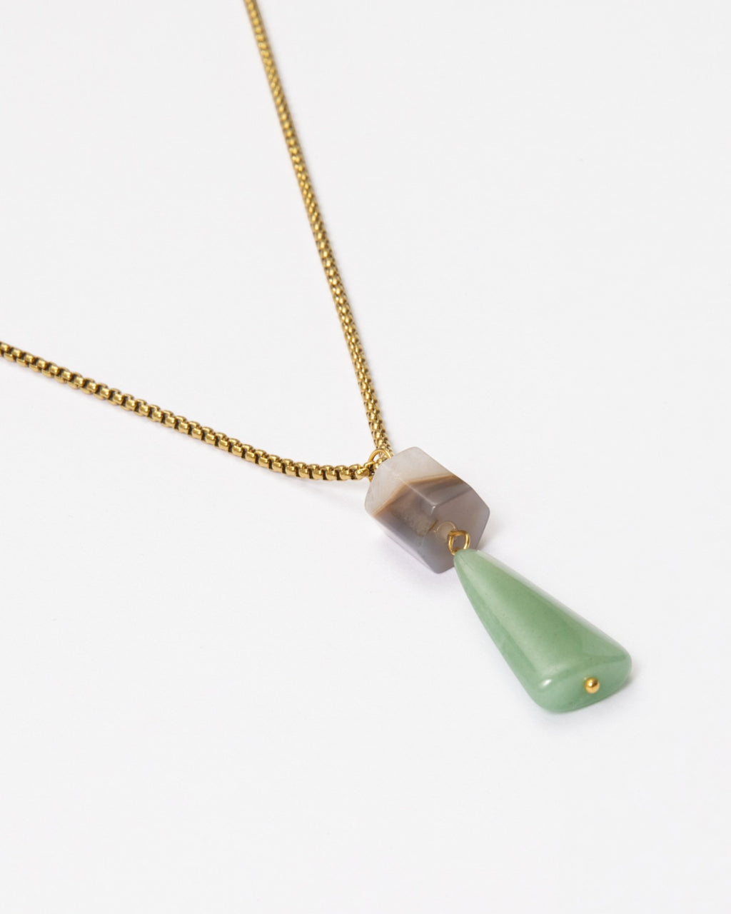 Elsita Jewelry Wildbach necklace featuring a hexagonal Uruguayan agate and a trapezoid green aventurine on a gold chain
