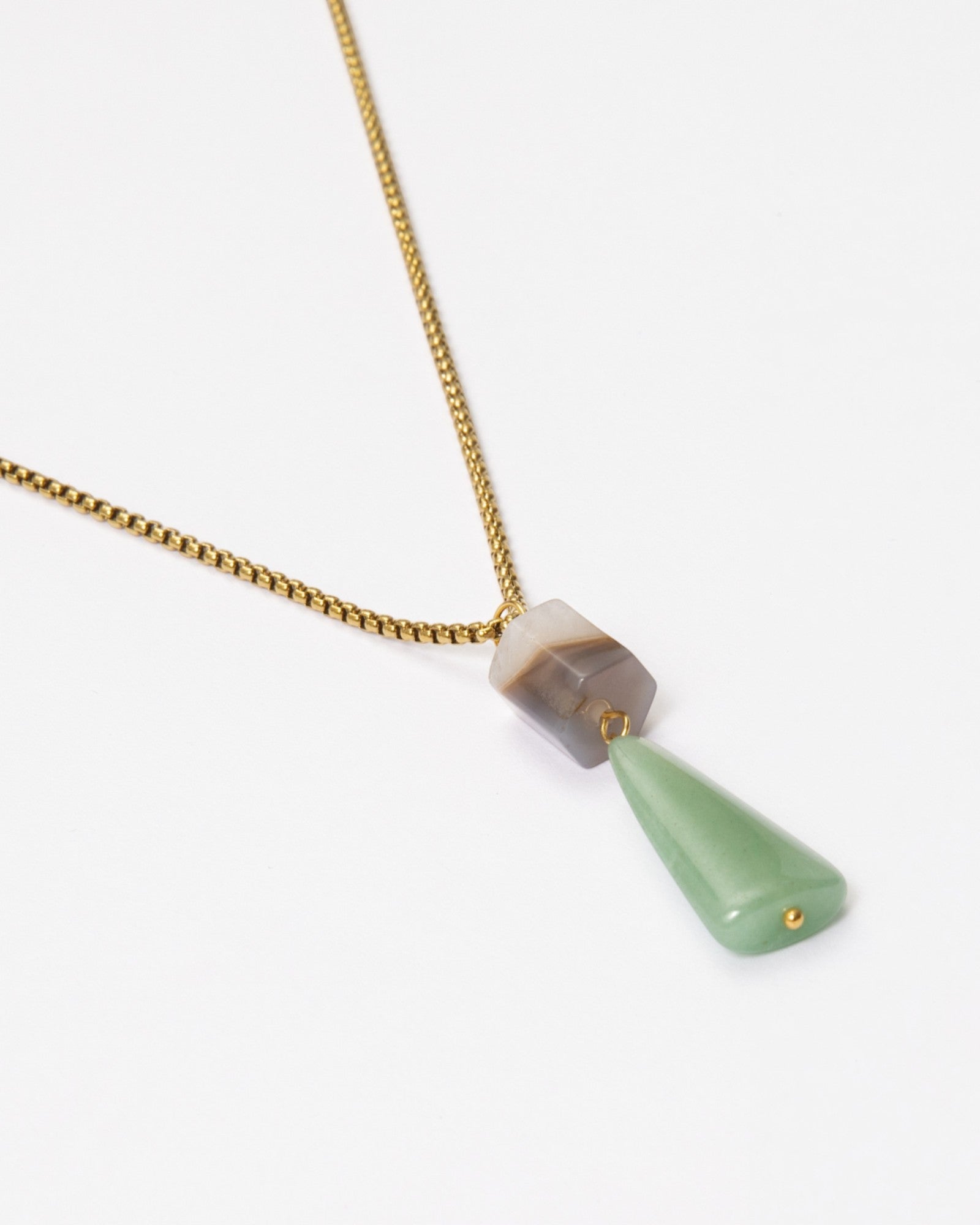 Elsita Jewelry Wildbach necklace featuring a hexagonal Uruguayan agate and a trapezoid green aventurine on a gold chain