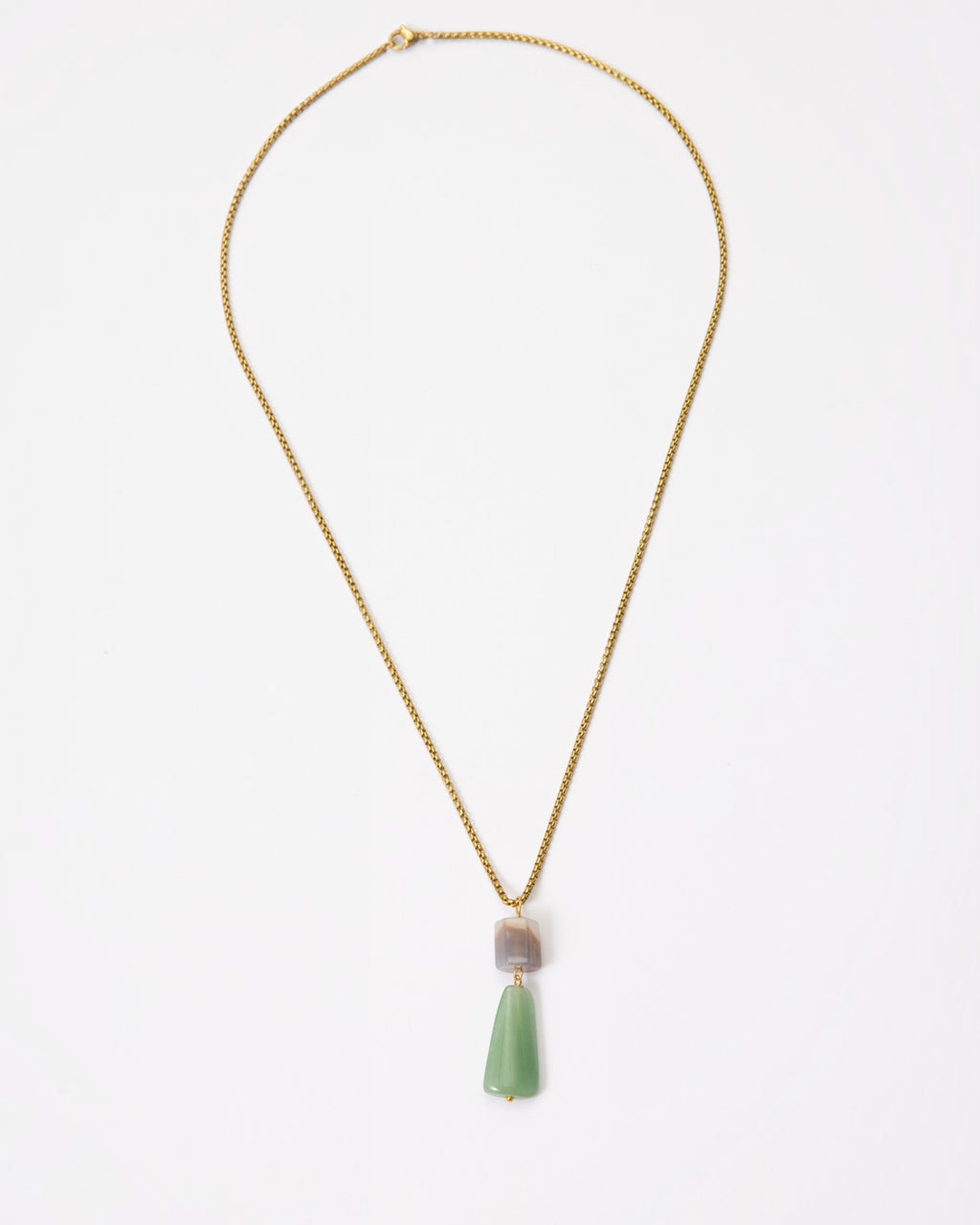 Elsita Jewelry Wildbach necklace featuring a hexagonal Uruguayan agate and trapezoid green aventurine on a brass chain