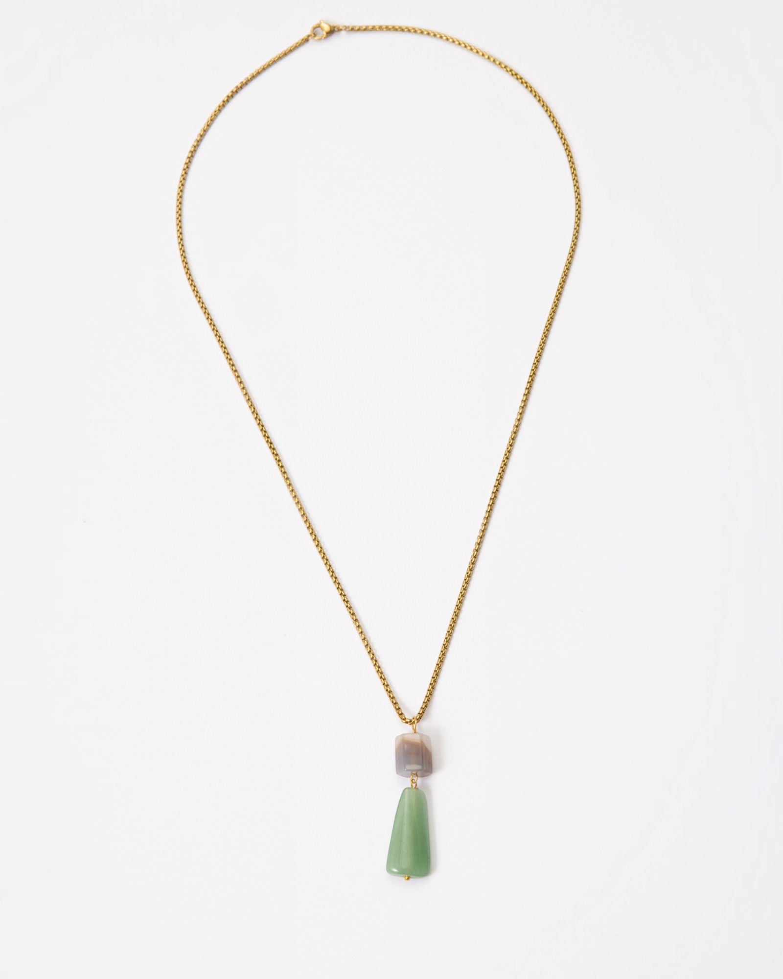 Elsita Jewelry Wildbach necklace featuring a hexagonal Uruguayan agate and trapezoid green aventurine on a brass chain