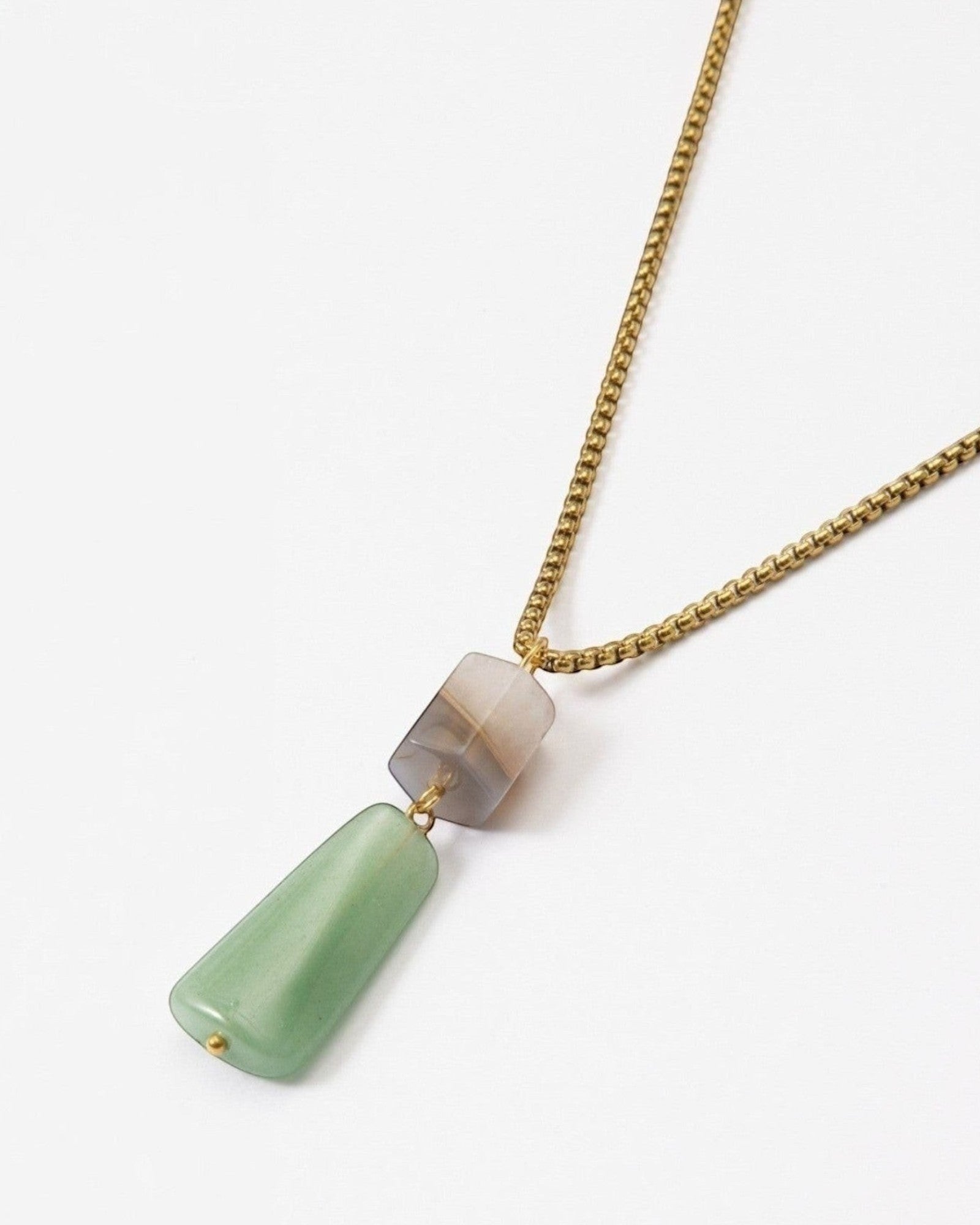 Elsita Jewelry Wildbach necklace featuring a hexagonal Uruguayan agate and trapezoid green aventurine on brass chain.