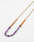 Elsita Jewelry long necklace featuring red agate, carnelian, and amethyst beads on a gold stainless steel chain.