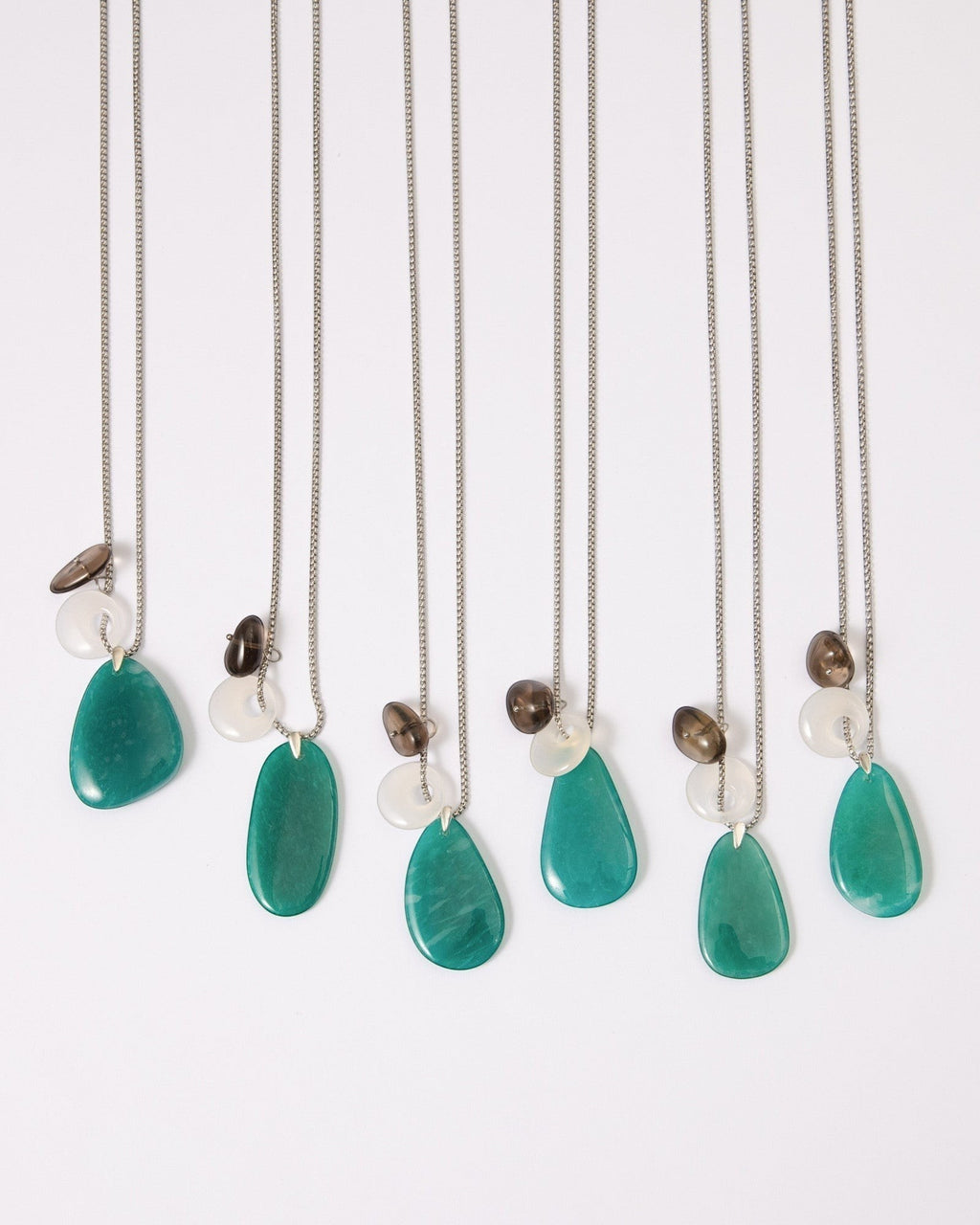 Elsita Jewelry Stein am Rhein necklaces featuring freeform Amazonite, white agate, and smoky quartz on silver chains.