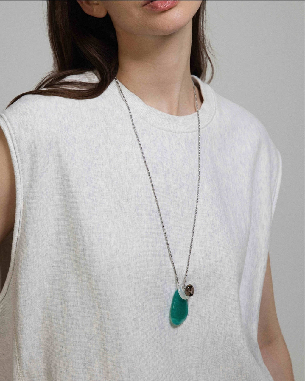 Elsita Jewelry Stein am Rhein necklace featuring a large green Amazonite, white agate, and smoky quartz on a silver chain.