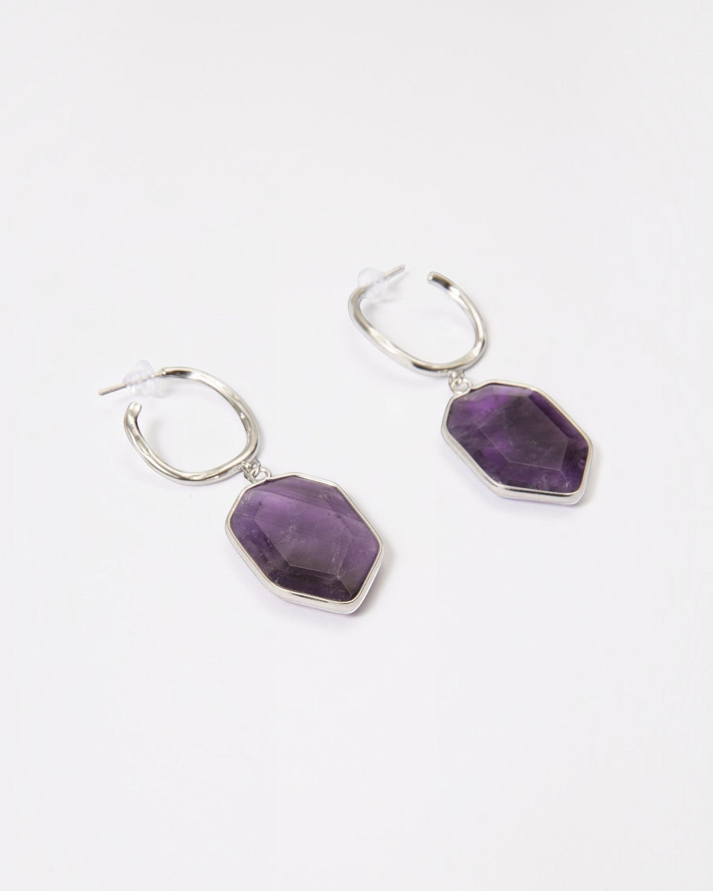 Elsita Jewelry Calm amethyst earrings featuring geometric violet stones on sterling silver hoops against white background