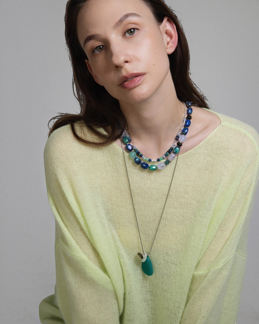 Model wearing Elsita Jewelry Blausee Depth layered necklace with azurite, amazonite, chalcedony, and black tourmaline beads