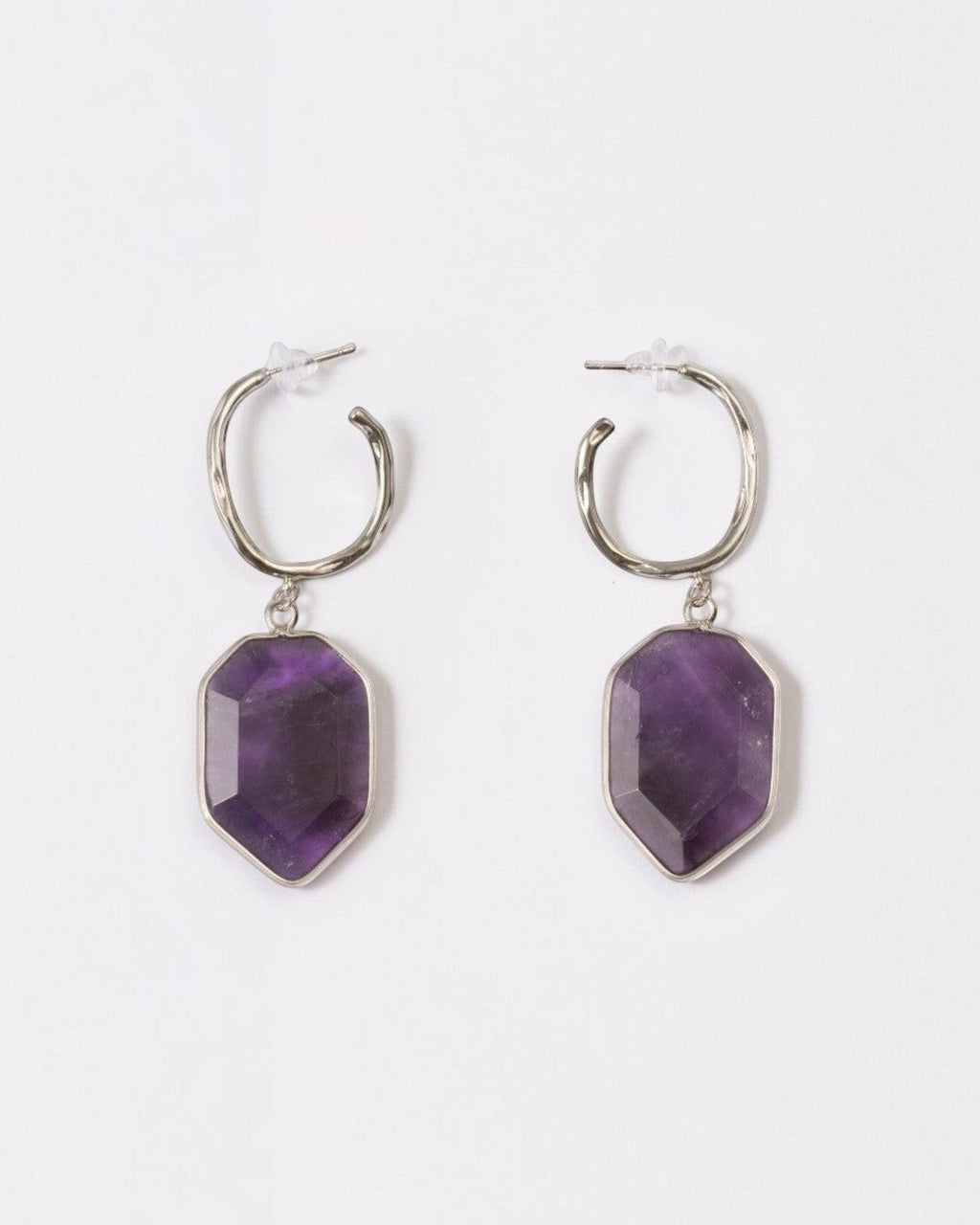 Elsita Jewelry Calm amethyst earrings featuring geometric deep violet stones on silver hoops against a white background.