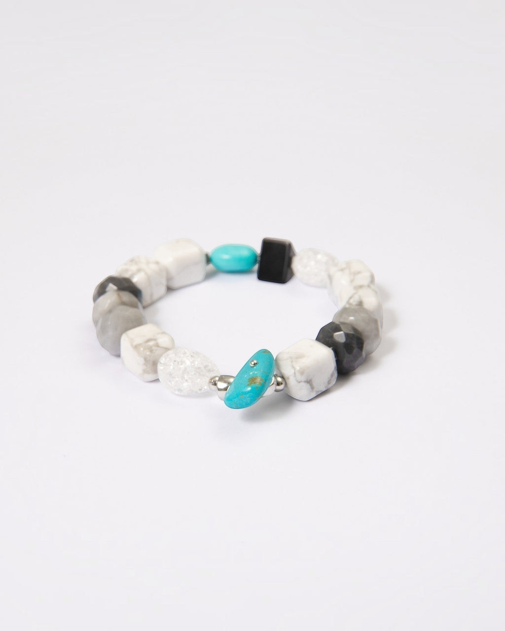 Elsita Jewelry Chill bracelet featuring turquoise, howlite, black agate, clear quartz, and hawk's eye mineral beads.