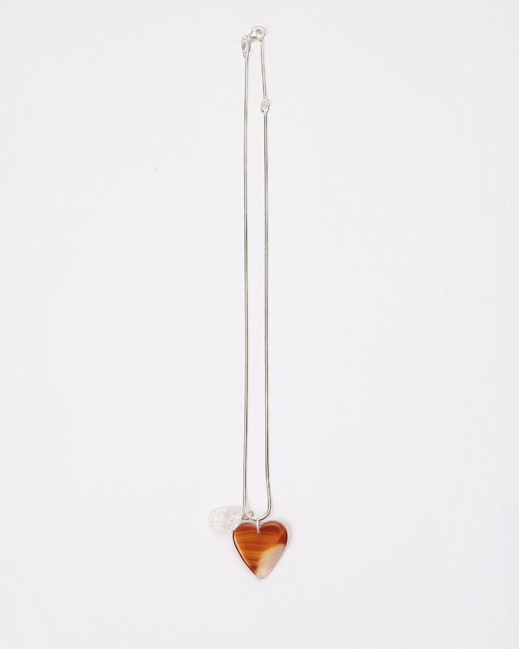 Elsita Jewelry Soda I heart-shaped red agate and clear quartz pendant necklace on a sterling silver snake chain