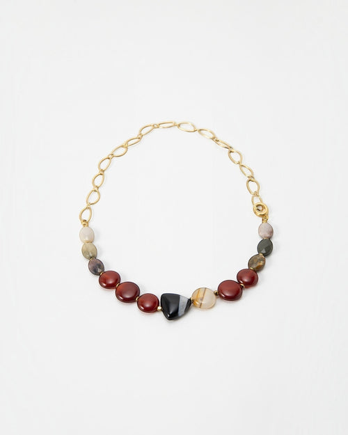Elsita Jewelry Herbst necklace featuring earthy multi-colored gemstone beads and a gold chain link design.