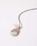 Elsita Jewelry Mauve V necklace featuring a teardrop Hyacinth Jasper pendant and clear quartz on a stainless steel chain.