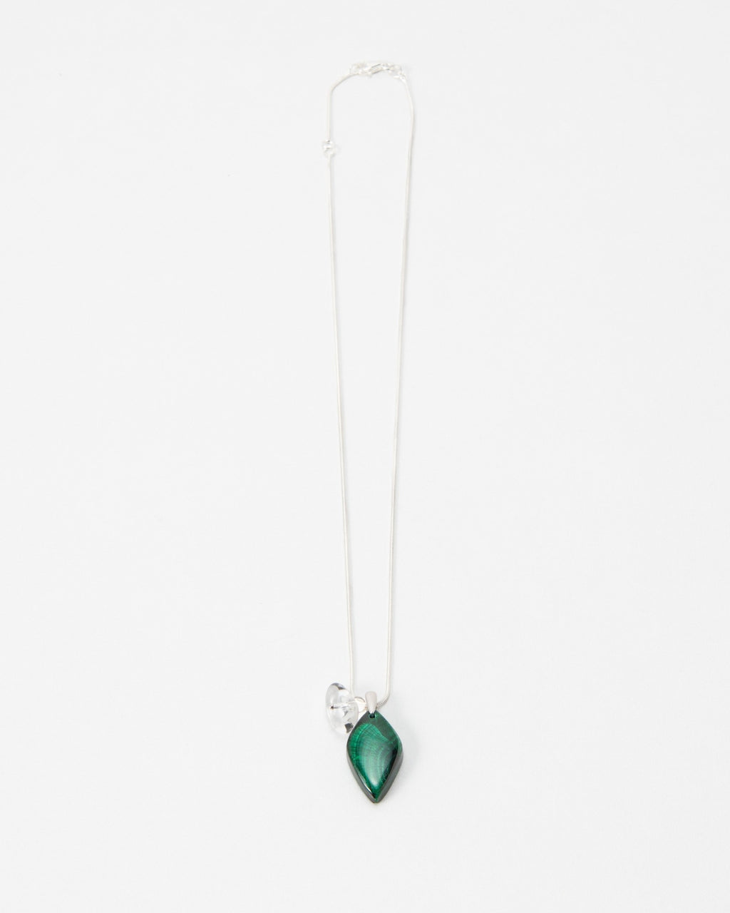 Elsita Jewelry Midnight necklace featuring a teardrop-shaped green malachite stone on a delicate silver chain.