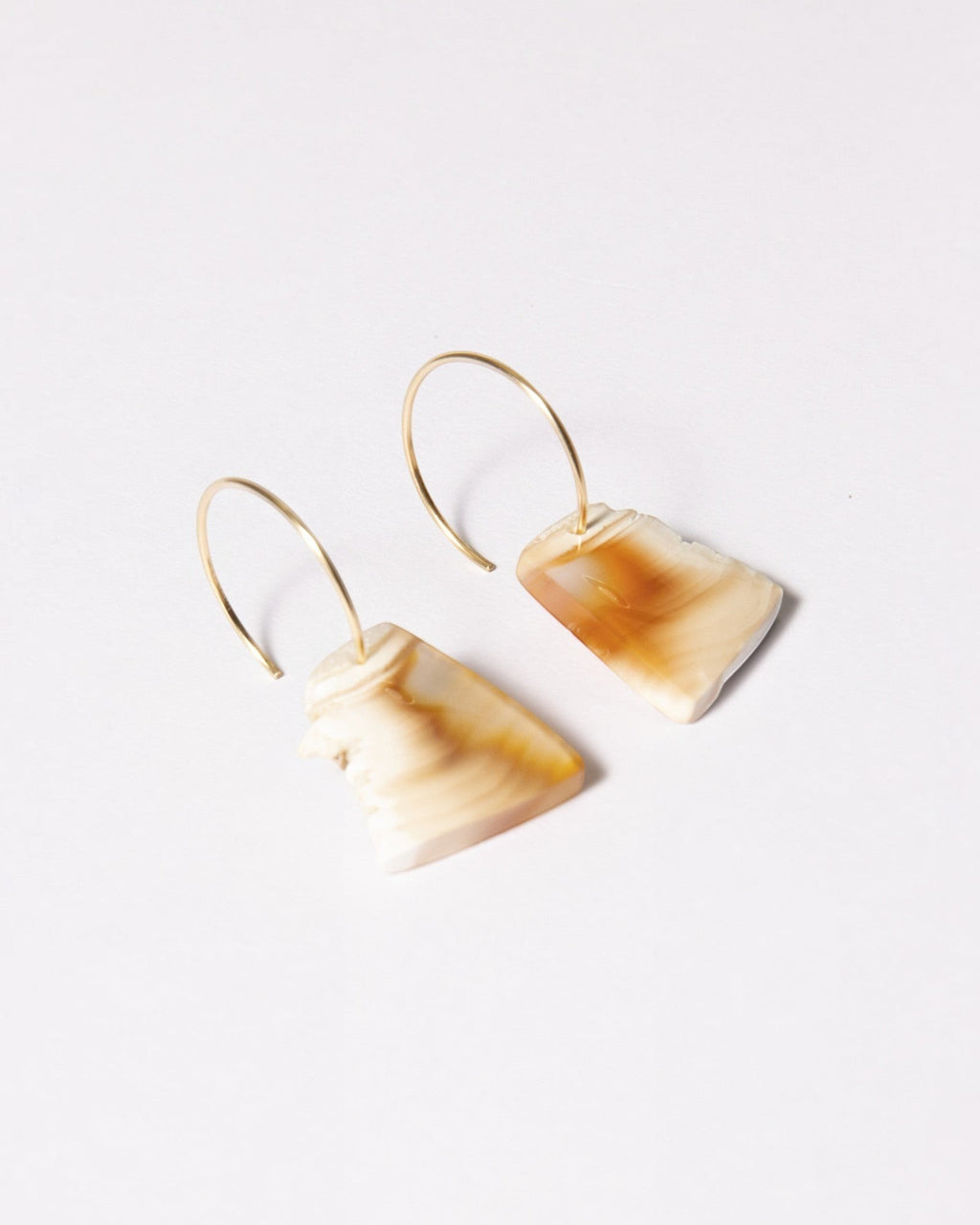 Elsita Jewelry Wild 2 raw Indonesian agate slice earrings on 14K gold-filled hoops with earthy beige and brown tones.