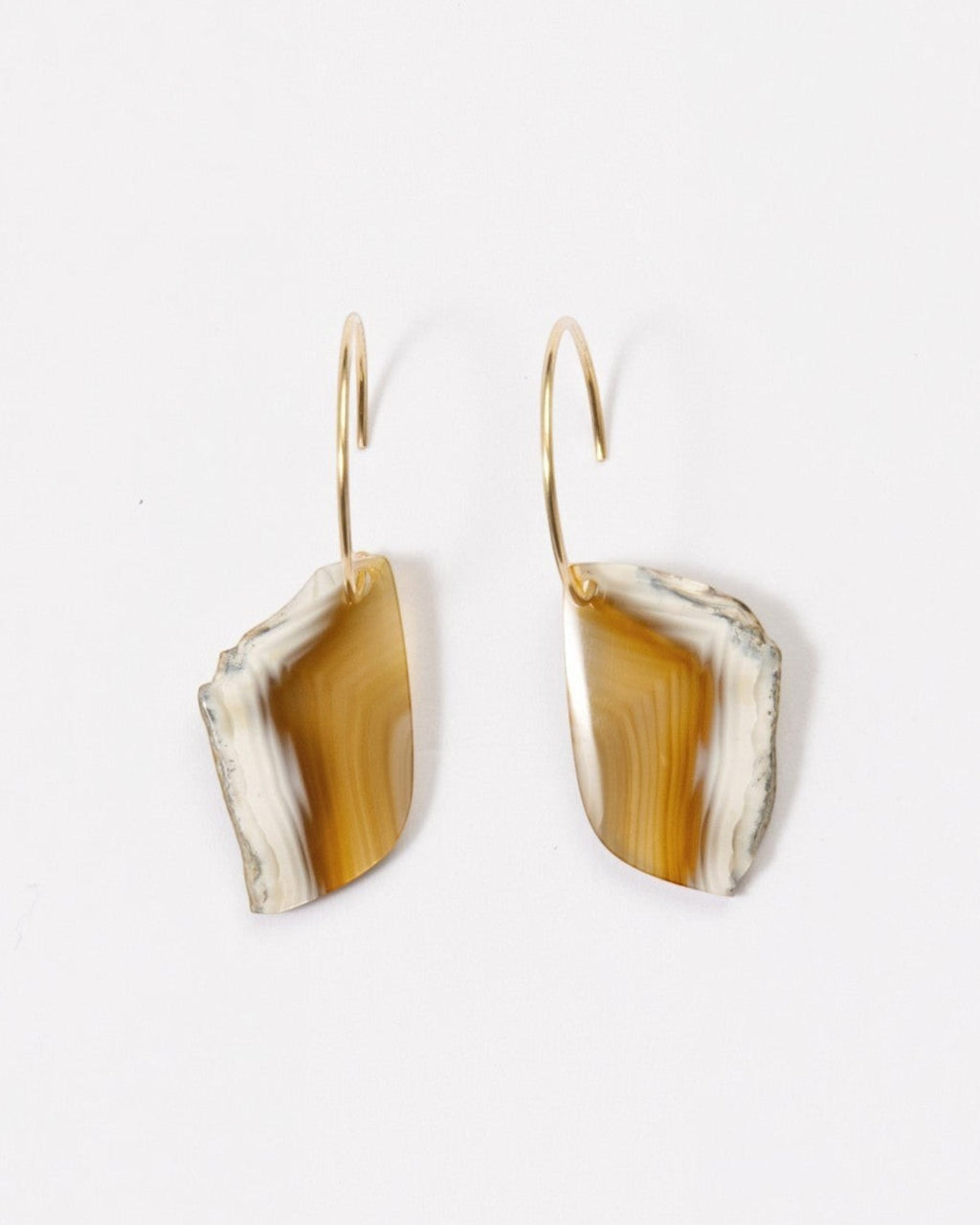 Elsita Jewelry Wild 19 earrings featuring raw Indonesian agate slices in beige and brown on 14K gold-filled hoops.