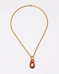 Elsita Jewelry Link Red necklace featuring a hand-carved red agate interlocked chain pendant on a gold-tone chain.