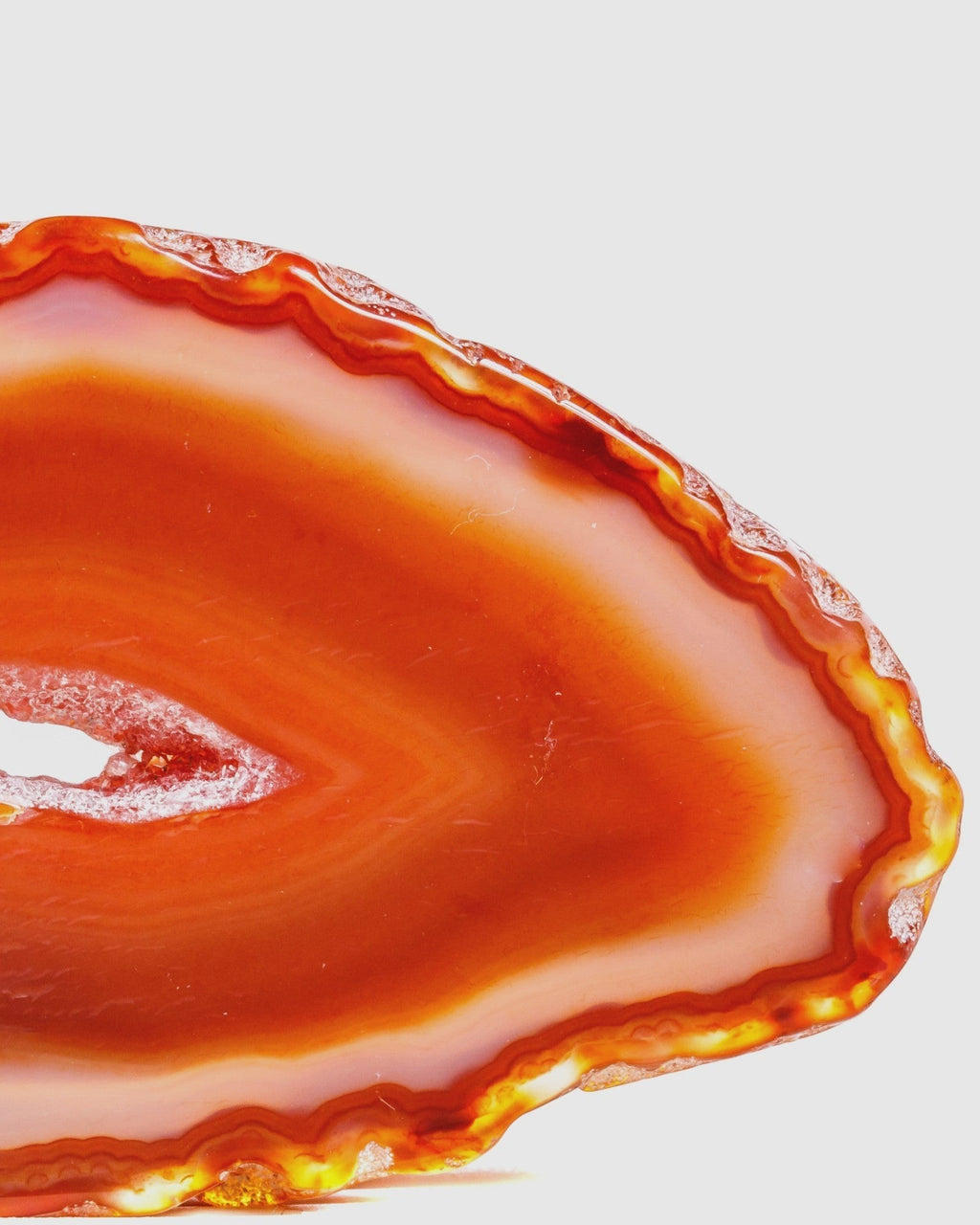 Elsita Jewelry Soda IV necklace pendant featuring a vibrant orange-red banded agate slice with natural crystalline edges.