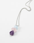 Elsita Jewelry Shape necklace featuring three faceted geometric gemstone beads in purple, pink, and light blue.