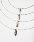 Elsita Jewelry Snowline Grey necklace featuring white howlite, grey agate, and green chrysoprase beads with silver.