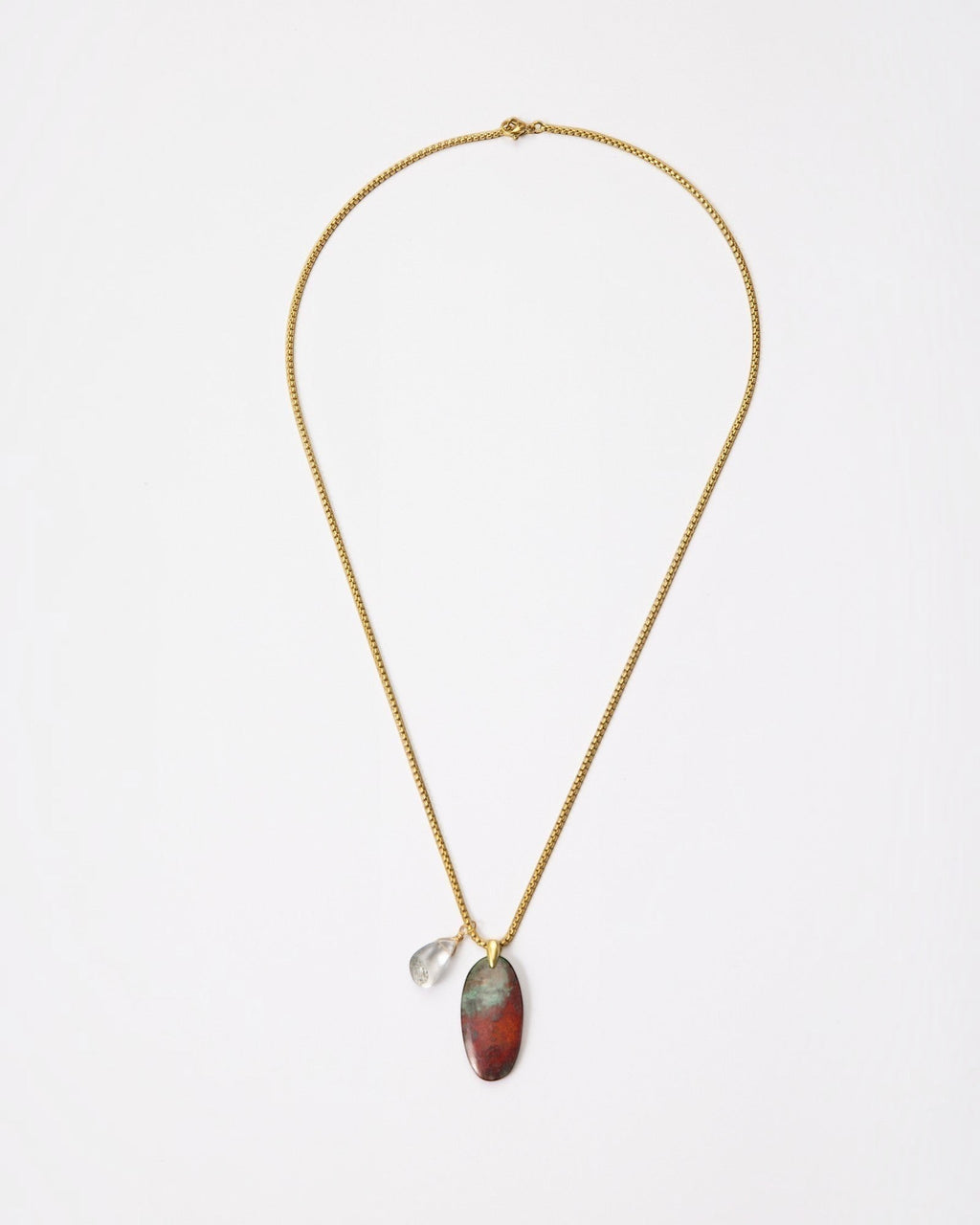 Elsita Jewelry Horizon IV necklace featuring an oval Sonora sunset stone and green quartz on a gold-tone chain.