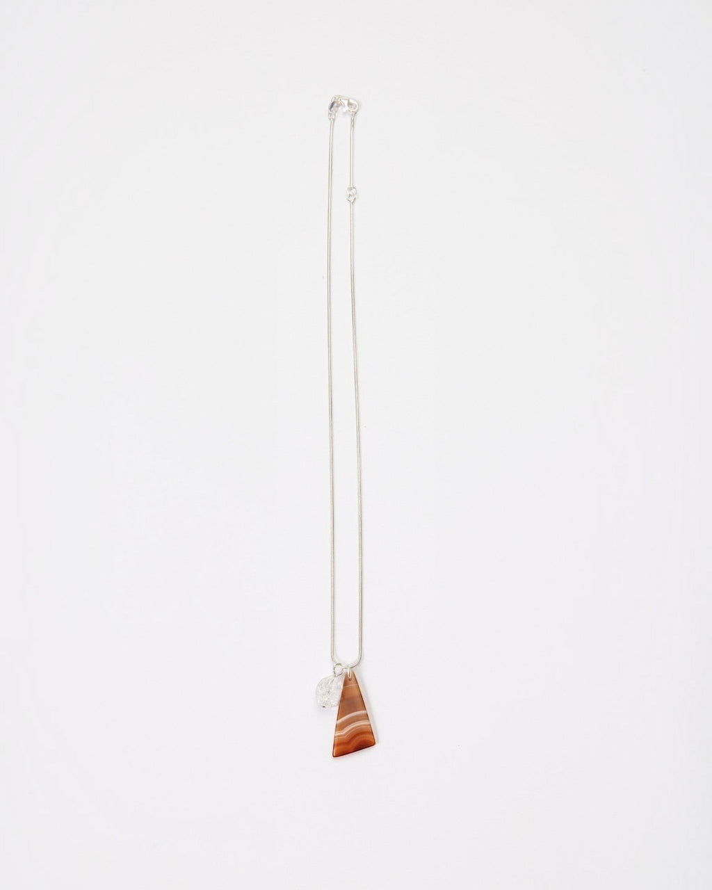 Elsita Jewelry Soda III necklace featuring a triangular red banded agate and clear quartz on a sterling silver chain.