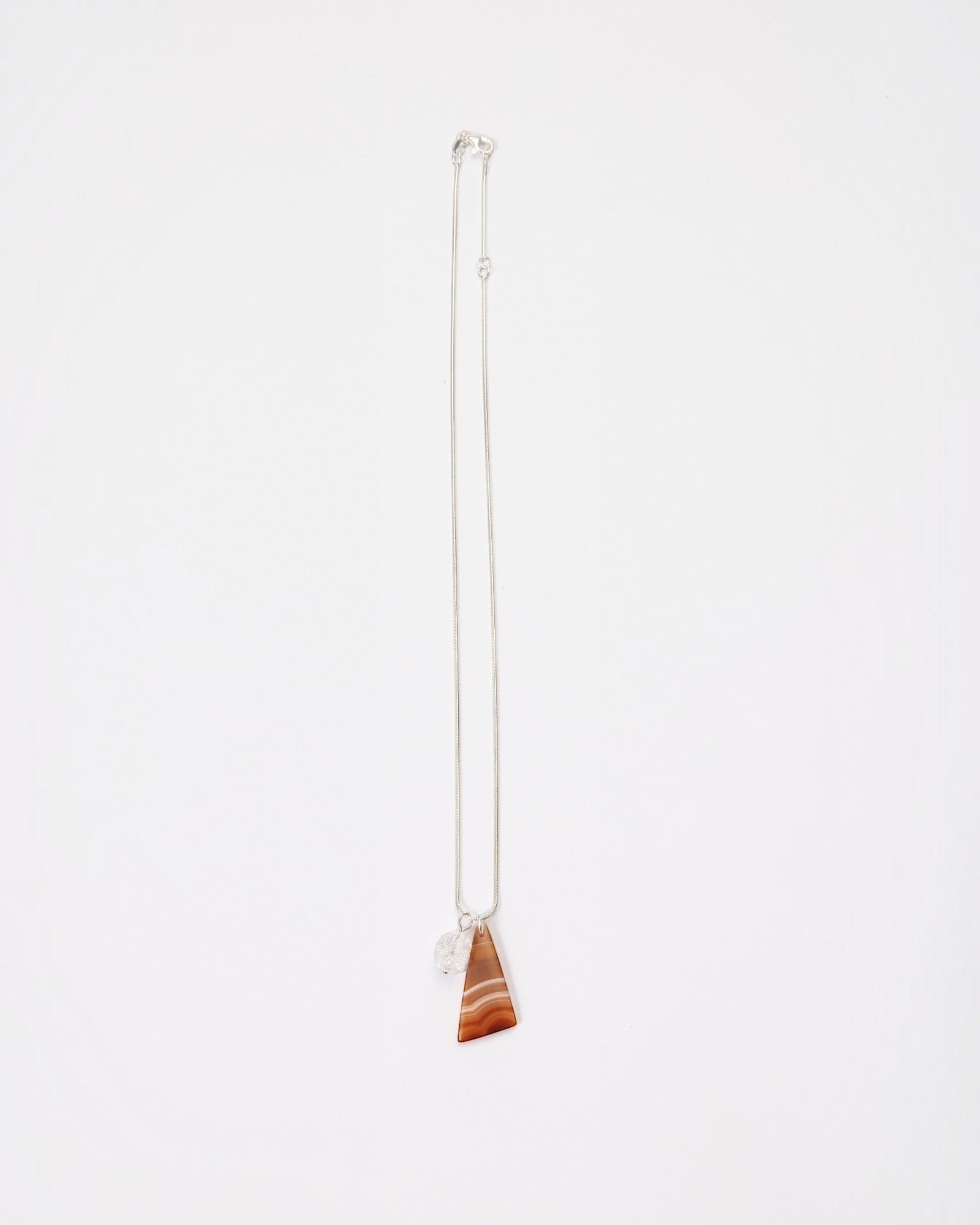 Elsita Jewelry Soda III necklace featuring a triangular red banded agate and clear quartz on a sterling silver chain.
