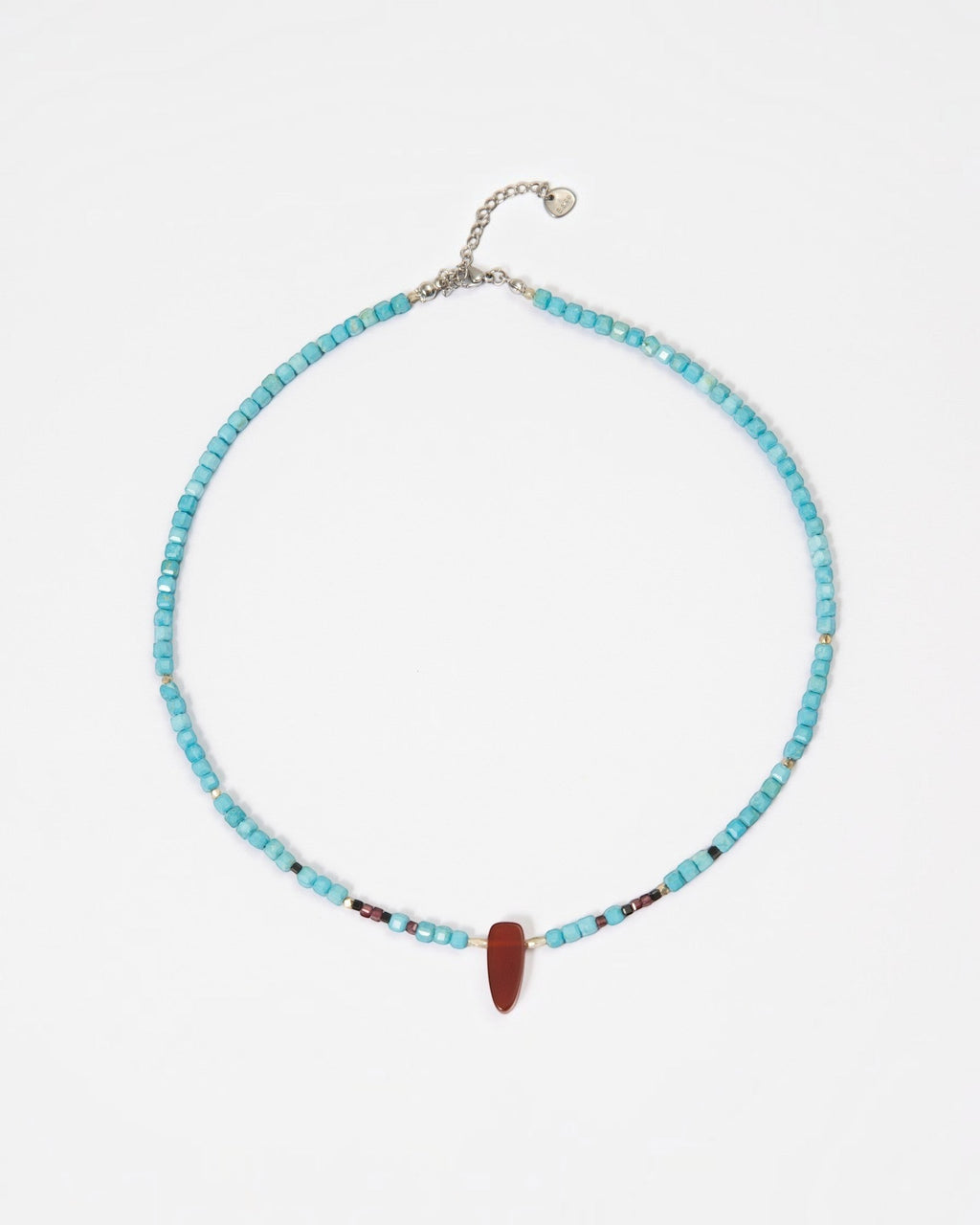 Elsita Jewelry Pixel necklace featuring turquoise cube beads, a red agate pendant, and silver accents on white.
