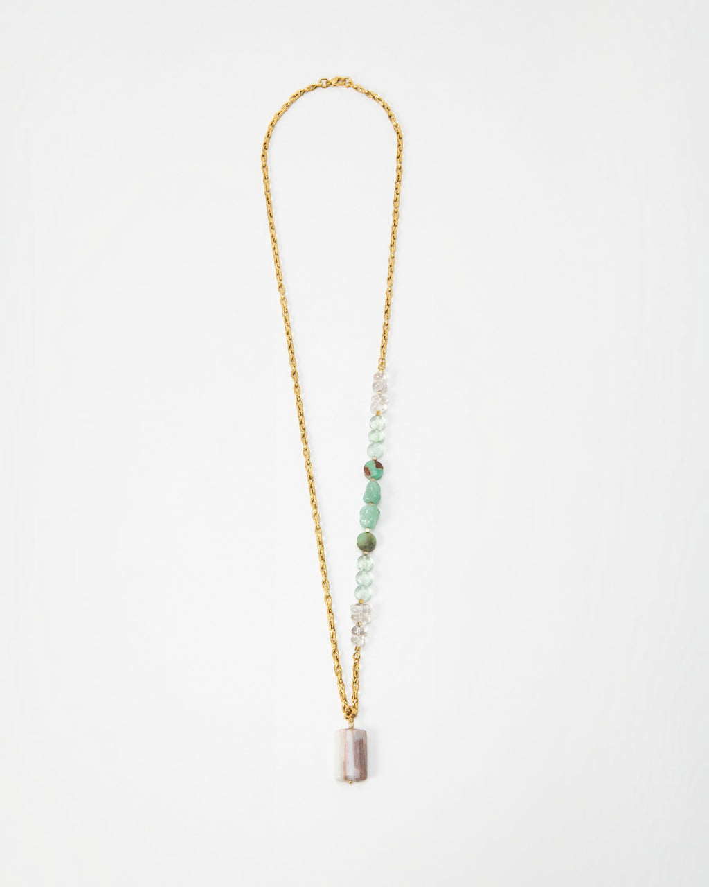 Elsita Jewelry Wandern necklace featuring a gold chain with green and clear gemstone beads and a rectangular pendant